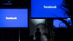 The Facebook Inc. logo sits on screens ahead of the global launch event of "Workplace" at the Facebook Inc. offices in London, U.K., on Monday, Oct. 10, 2016. Workplace is meant to help employees collaborate with one another on products, listen to their bosses speak on Facebook Live and post updates on their work in the News Feed. Photographer: Jason Alden/Bloomberg