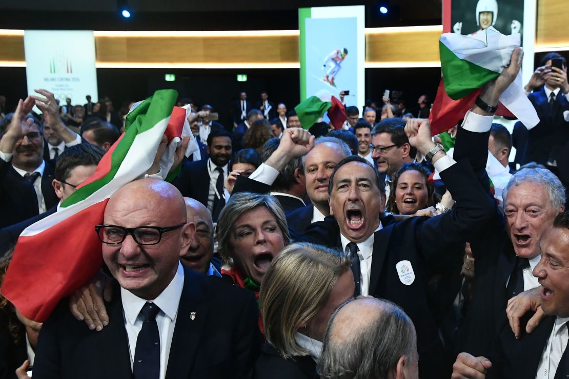 Members of the Milan bid celebrate the IOC's decision.