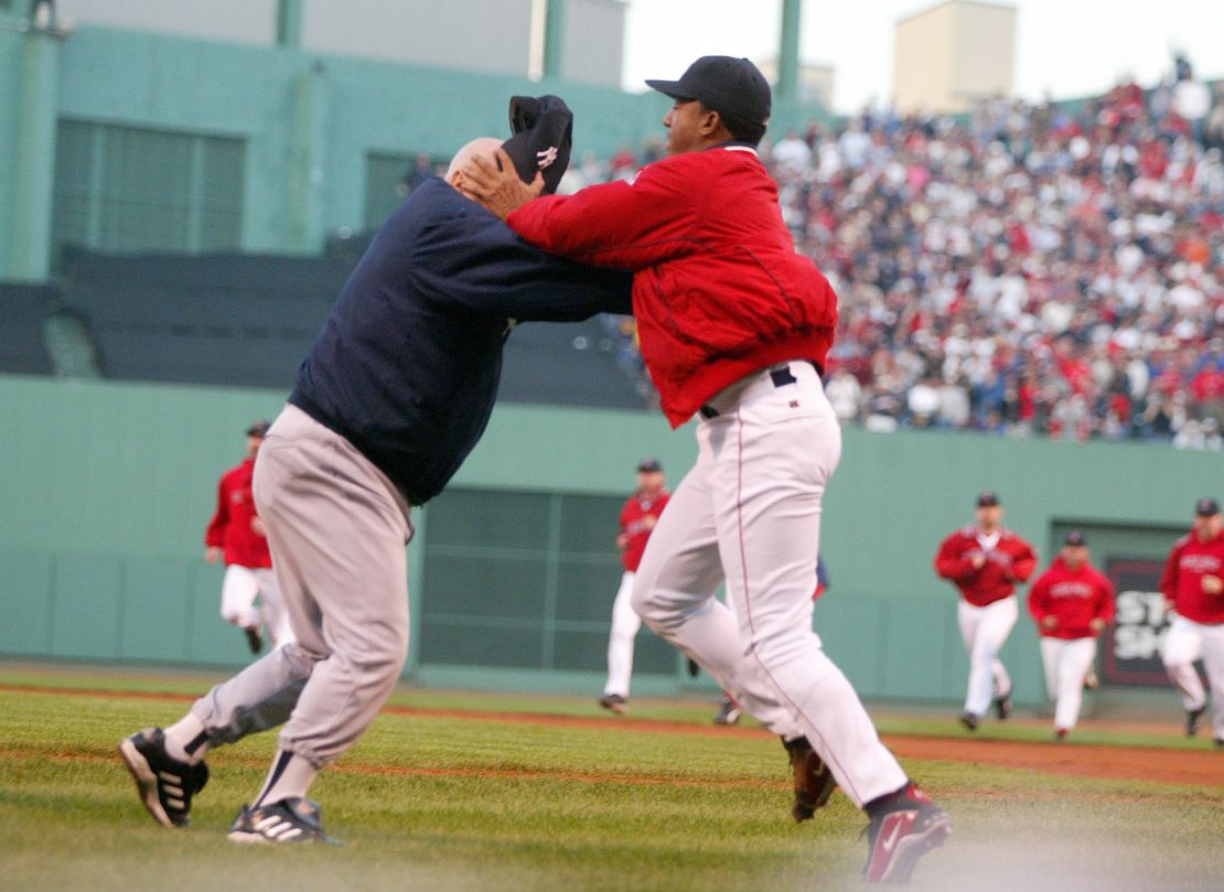Boston Red Sox pitcher Pedro Martinez (R), throws 72-year-old New York Yankees coach Don Zimmer to the ground during an altercation in Game 3 of the American League championship series in Boston in 2003. Martinez called the incident the biggest regret of his career. 