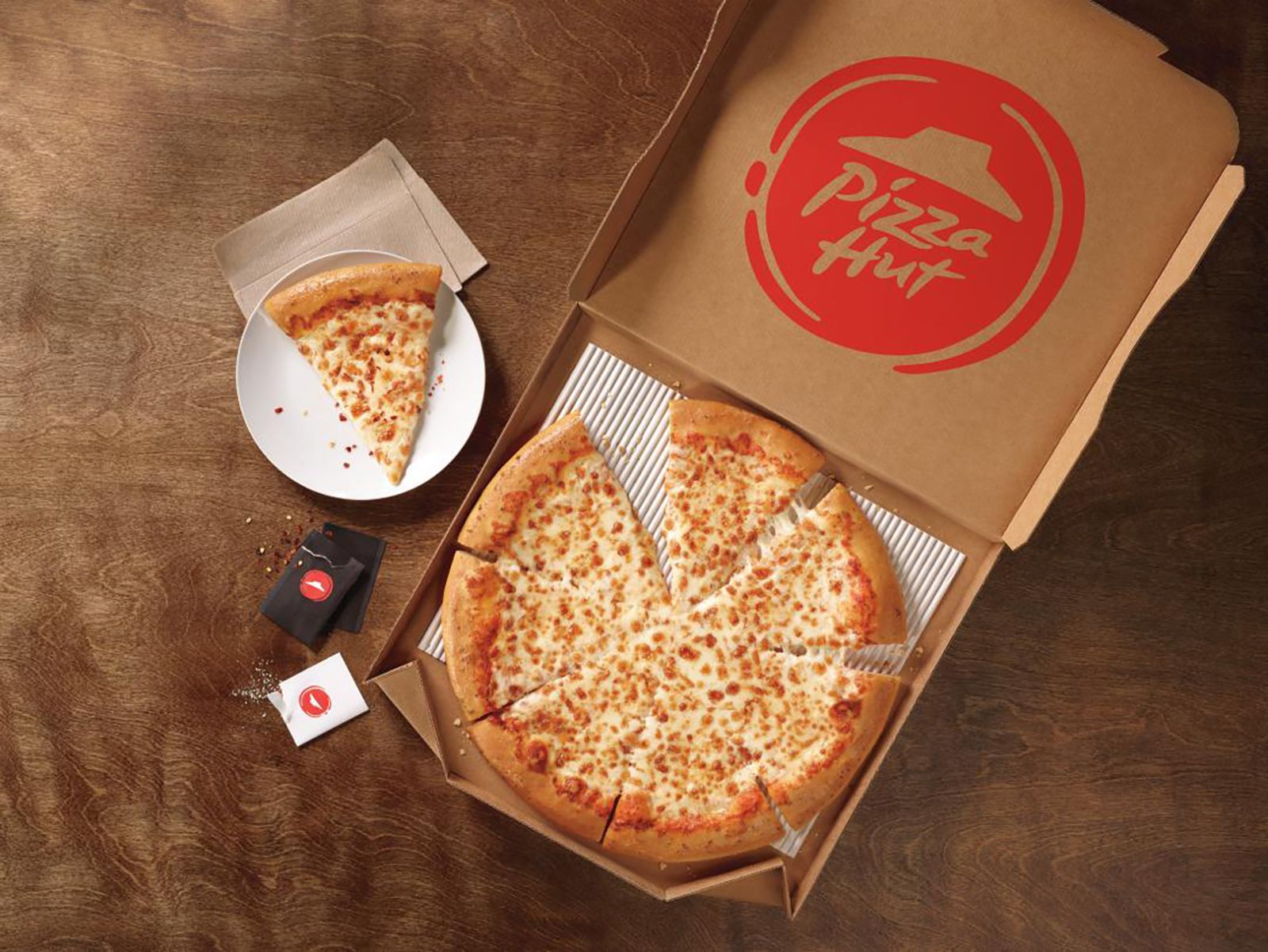The Strange Reason Domino's Just Unveiled New Retro Pizza Boxes