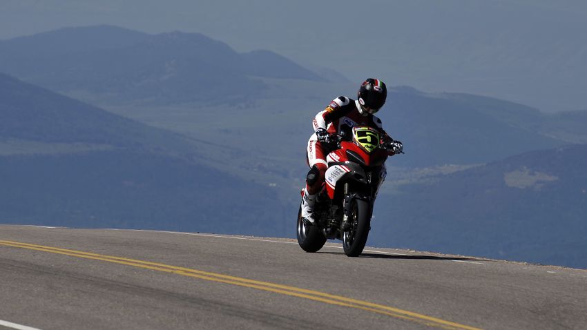 COLORADO SPRINGS, COLORADO - AUGUST 12:  Ducati rider Carlin Dunne makes his way to the finish during the Pikes Peak International Hill Climb on August 12, 2012 in Colorado Springs, Colorado. The race takes place over a 12.42 mile course with 156 corners finishing at 14,110 feet at the summit of Pikes Peak. (Photo by Rainier Ehrhardt/Getty Images)