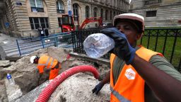 A worker drinks water while working on June 24, 2019 in Bordeaux, western France, as temperatures soar to 35 degrees Celsius. - Up to 40 degrees celsius during the day, 25 at night: France will know this week a heat wave exceptional in its precocity and intensity, warns on June 21, 2019 Meteo-France, saying that the heat waves are multiplying with the global warming. (Photo by MEHDI FEDOUACH / AFP)        (Photo credit should read MEHDI FEDOUACH/AFP/Getty Images)