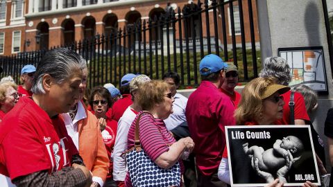 Anti-abortion activists hold a rally outside the Massachusetts Statehouse in Boston on June 17, 2019.