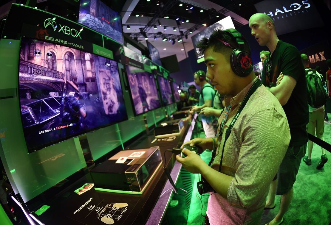 Gamer Jonathan Martinez tests a new "Gears of War" game at the Xbox display on the second day of the Electronic Entertainment Expo, known as E3 at the Convention Center in Los Angeles, California on June 17, 2015.  The expansive E3 show floor was rich with VR offerings from developers working on games for immersive head gear expected to hit the market in force next year.        AFP PHOTO / MARK RALSTON        (Photo credit should read MARK RALSTON/AFP/Getty Images)