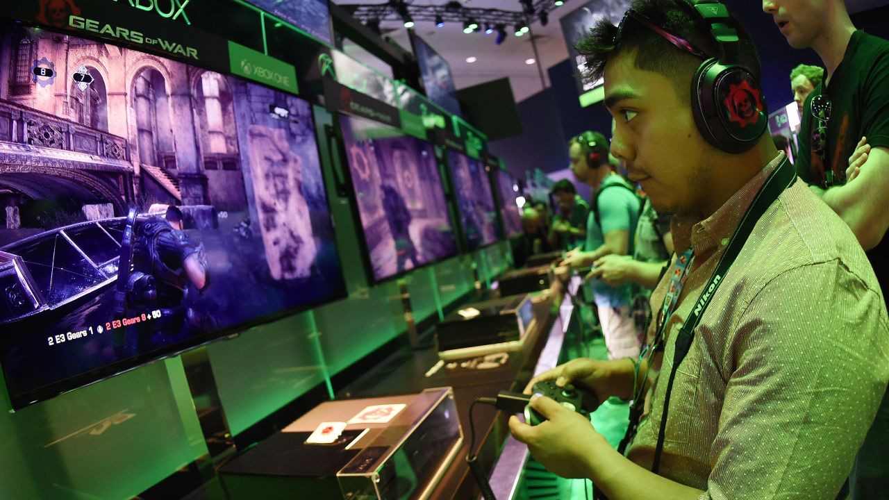 Gamer Jonathan Martinez tests a new "Gears of War" game at the Xbox display on the second day of the Electronic Entertainment Expo, known as E3 at the Convention Center in Los Angeles, California on June 17, 2015.  The expansive E3 show floor was rich with VR offerings from developers working on games for immersive head gear expected to hit the market in force next year.        AFP PHOTO / MARK RALSTON        (Photo credit should read MARK RALSTON/AFP/Getty Images)
