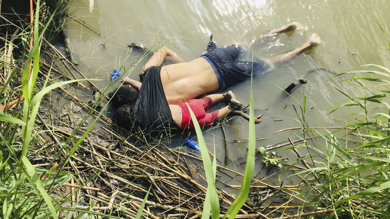 EDS NOTE: GRAPHIC CONTENT - The bodies of Salvadoran migrant Oscar Alberto Martínez Ramírez and his nearly 2-year-old daughter Valeria lie on the bank of the Rio Grande in Matamoros, Mexico, Monday, June 24, 2019, after they drowned trying to cross the river to Brownsville, Texas. Martinez' wife, Tania told Mexican authorities she watched her husband and child disappear in the strong current. (AP Photo/Julia Le Duc)