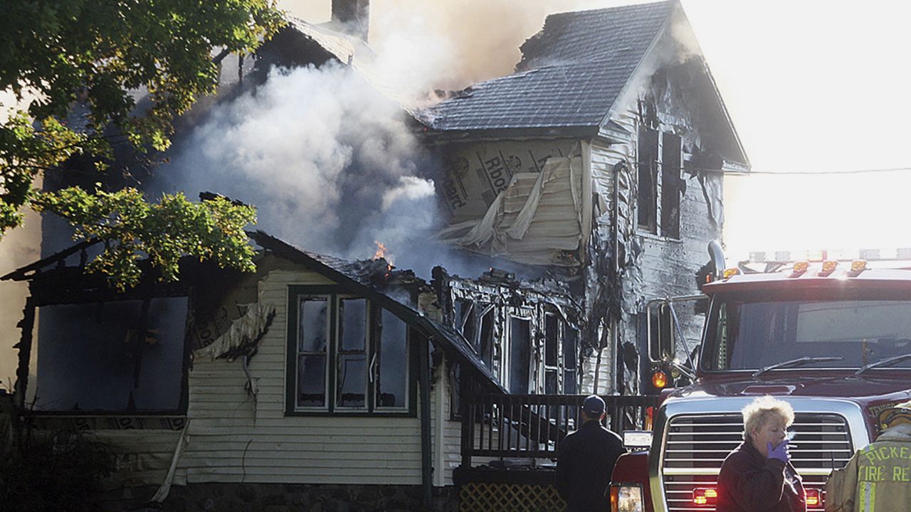 Responders work the scene of a deadly house fire in Pickerel, Wisconsin on Tuesday. 