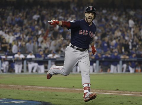 Steve Pearce of the Red Sox celebrates his second home run during the eighth inning in Game 5 of the 2018 World Series against the Los Angeles Dodgers. The Red Sox won the series 4-1, marking Boston's ninth MLB championship. 