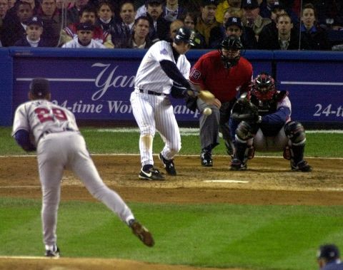 Yankee Tino Martinez singles to drive in two runs during Game 4 of the 1999 World Series in New York. The Yankees swept the Atlanta Braves 4-0 for their 25th World Series title. 
