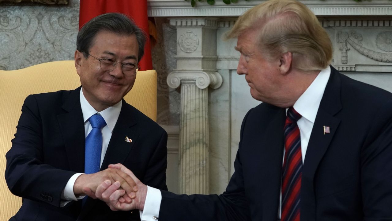 US President Donald Trump and South Korean President Moon Jae-in shake hands at the White House on April 11, 2019.