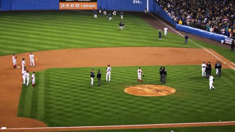 Fans throw items onto the field at Yankee Stadium after Rodriguez was called out for interference during the play.