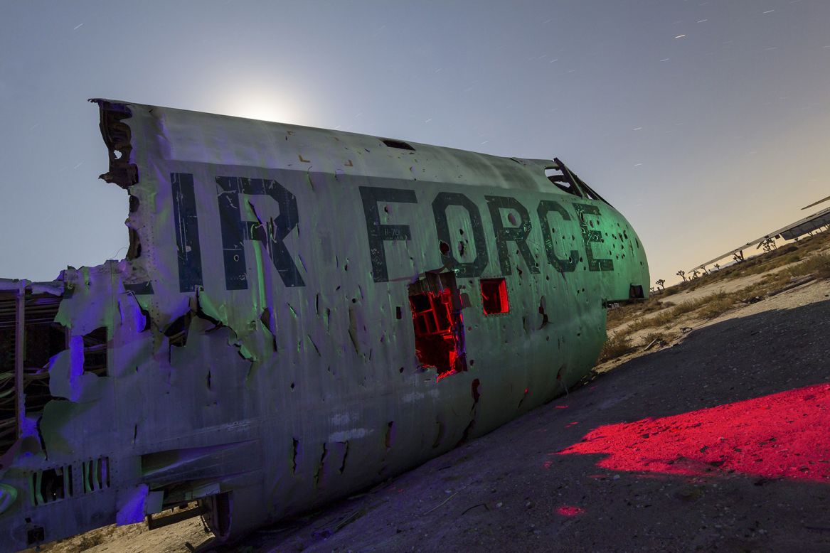 The still-visible lettering on this B-52 Stratofortress reminds viewers that this decrepit wreckage was once a part of US military operations. 