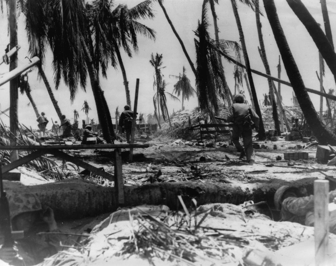 US Marines charge a hill on Tarawa in the early stages of the battle on the Japanese-held atoll in the Gilbert Islands.