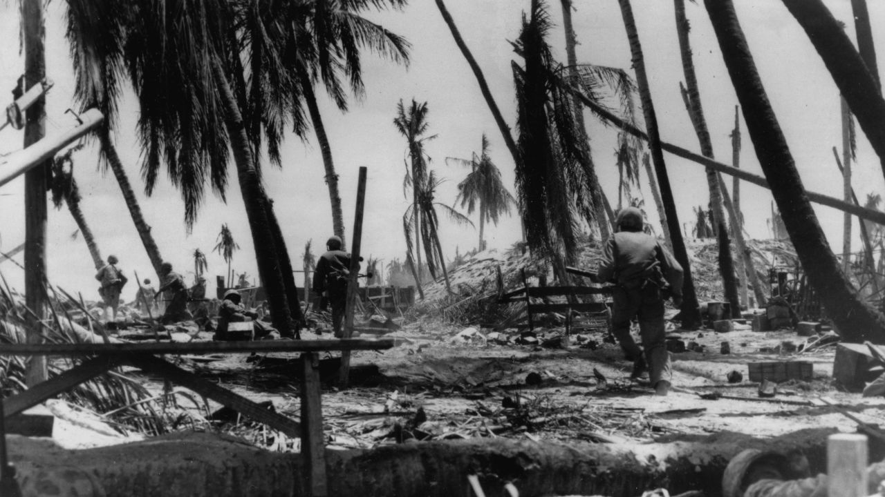 US Marines charge a hill on Tarawa in the early stages of the battle on the Japanese-held atoll in the Gilbert Islands.