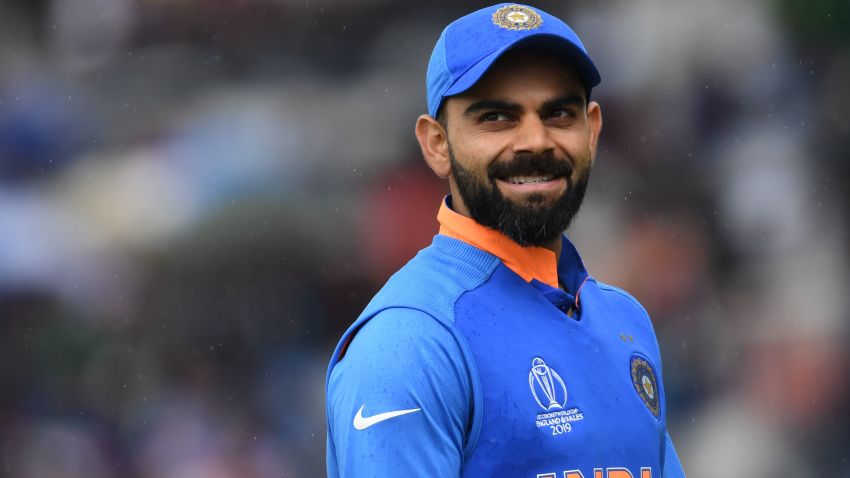India's captain Virat Kohli looks on as rain falls during the 2019 Cricket World Cup group stage match between India and Pakistan at Old Trafford in Manchester, northwest England, on June 16, 2019. (Photo by Dibyangshu SARKAR / AFP) / RESTRICTED TO EDITORIAL USE (Photo credit should read DIBYANGSHU SARKAR/AFP/Getty Images)