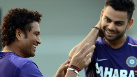 Tendulkar shares a light moment with Kohli during a training session in Mumbai on November 9, 2012.