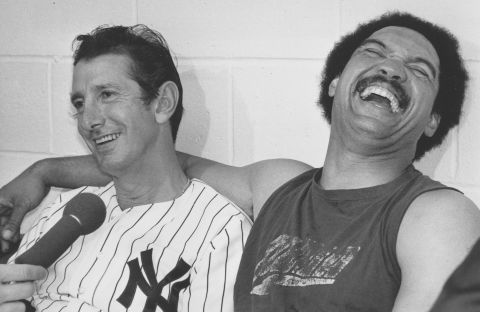 New York Yankees manager Billy Martin (L) and slugger Reggie Jackson often butted heads, but shared a laugh after winning the 1977 World Series at Yankee Stadium. Jackson clinched the series with three home runs in Game 6 against the Los Angeles Dodgers. 