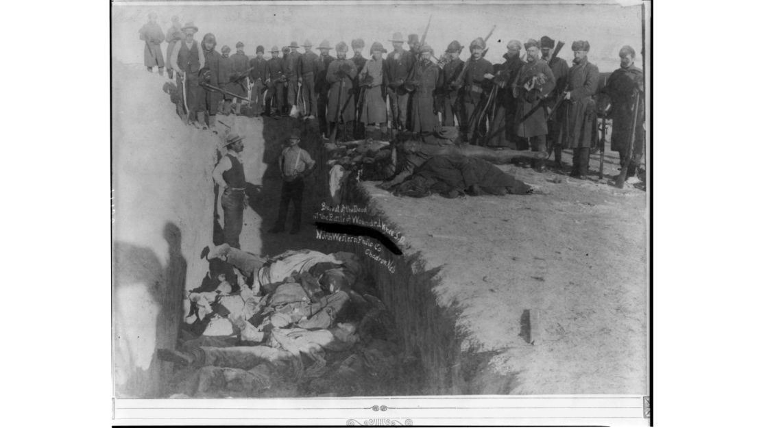 US soldiers burying the Native Americans massacred at Wounded Knee in Wounded Knee, South Dakota. 