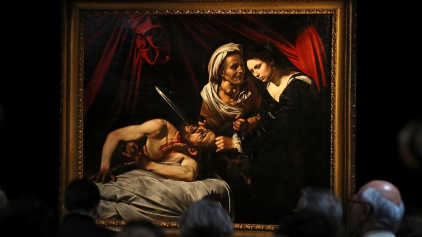 A painting, believed to be the second version of "Judith Beheading Holofernes" by Italian artist Michelangelo Merisi da Caravaggio, is picutred during a photocall in London on February 28, 2019, following its restoration. - The 400-year-old canvas -- depicting the beheading of an Assyrian general, Holofernes, by Judith from the biblical Book of Judith -- was found in 2014 when the owners of a house near the southwestern city of Toulouse in France, were investigating a leak in the ceiling. It is a burst of violence painted in haunting tones by a Renaissance master worth at least $100 million -- or yet another fake distressing the art world. (Photo by Daniel LEAL-OLIVAS / AFP)        (Photo credit should read DANIEL LEAL-OLIVAS/AFP/Getty Images)