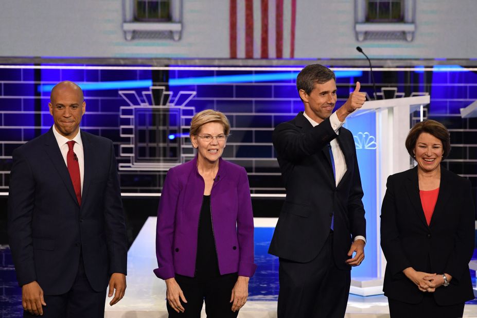 O'Rourke gives a thumbs-up before the start of the first Democratic debates in June 2019. With him, from left, are US Sens. Cory Booker, Elizabeth Warren and Amy Klobuchar.