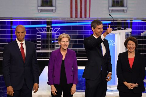 From left, Booker, Warren, O'Rourke and Klobuchar pose on stage before the start of the debate Wednesday.