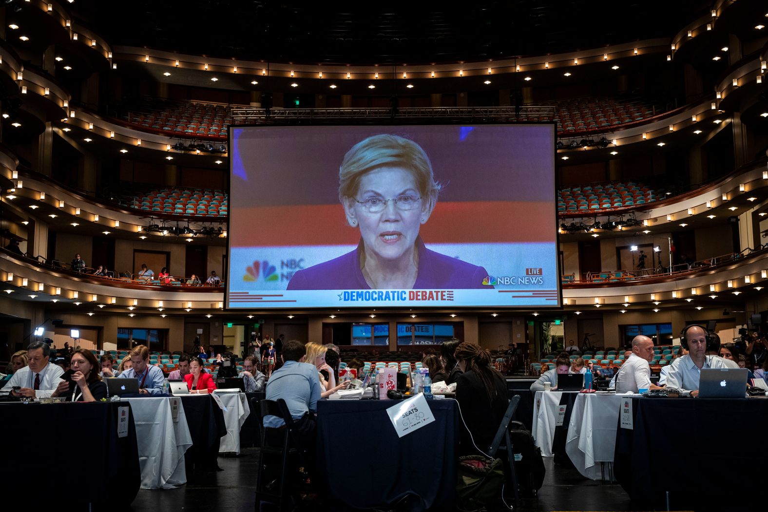 Warren is displayed on a monitor inside the spin room at the Arsht Center. The US senator from Masschusetts is <a href="index.php?page=&url=https%3A%2F%2Fwww.cnn.com%2Fpolitics%2Flive-news%2Fdemocratic-debate-june-26-2019%2Fh_f7eb98576555e7400b94bb91b965b44b" target="_blank">the only candidate from Wednesday's debate who is polling above 5%.</a> She became a progressive star by taking on Wall Street after the 2007 financial crisis.