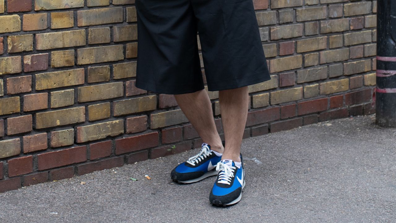 A guest at London Fashion Week wearing Undercover x Nike sneakers in London in June.