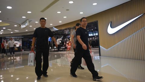 People walking out of a Nike store in Beijing last September.