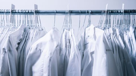 Lab coats hang inside the lab.