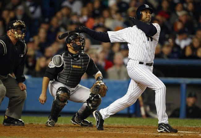 Bernie Williams of the New York Yankees hits a solo home run in the sixth inning during game 1 of the 2003 World Series. The Yankees would lose the series to the Florida Marlins, but Williams holds the MLB record for most career playoff RBI. 
