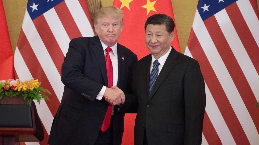 US President Donald Trump (L) shakes hands with China's President Xi Jinping during a press conference at the Great Hall of the People in Beijing on November 9, 2017. 
Donald Trump urged Chinese leader Xi Jinping to work "hard" and act fast to help resolve the North Korean nuclear crisis, during their meeting in Beijing Thursday, warning that "time is quickly running out".