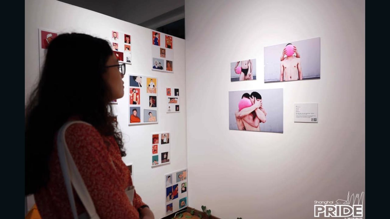 A visitor attends this year's Pride Art Opening at Polar Bear Gallery in Shanghai. 
