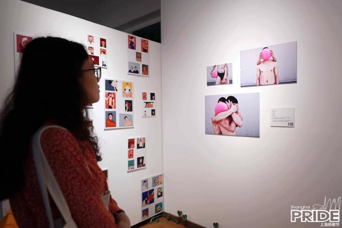 A visitor attends this year's Pride Art Opening at Polar Bear Gallery in Shanghai. 