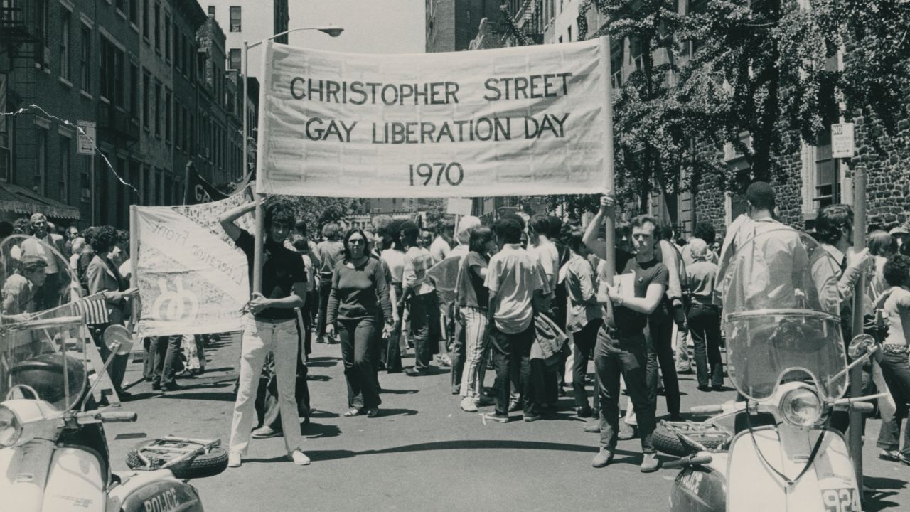 Gay rights supporters rally on the first anniversary of the Stonewall riots.