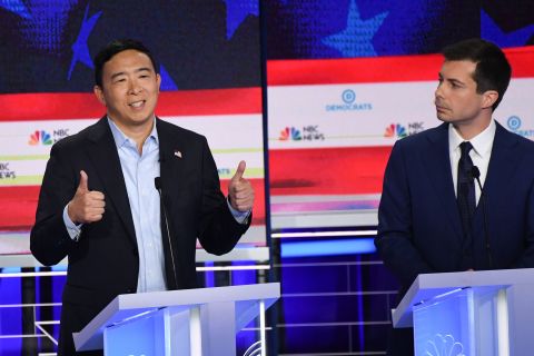 Yang answers a question while Buttigieg looks on. <a href="https://www.cnn.com/politics/live-news/democratic-debate-june-27-2019/h_cc7dd7dbb0234b00abcea7f0d23e956a" target="_blank">Yang's platform</a> includes a plan for universal basic income. He wants to give all Americans over the age of 18 $1,000 per month to address economic inequality. He argues the policy would play a key role in restructuring the modern economy to make it more equitable.