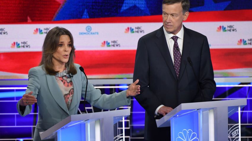 Democratic presidential hopefuls US author and writer Marianne Williamson (L) and Former Governor of Colorado John Hickenlooper (R) participate in the second Democratic primary debate of the 2020 presidential campaign season hosted by NBC News at the Adrienne Arsht Center for the Performing Arts in Miami, Florida, June 27, 2019. - The candidates raised their hands in approval when asked if their health care for all plan would cover undocumented immigrants. (Photo by SAUL LOEB / AFP)        (Photo credit should read SAUL LOEB/AFP/Getty Images)