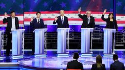 MIAMI, FLORIDA - JUNE 27: Democratic presidential candidates (L-R) former tech executive Andrew Yang, South Bend, Indiana Mayor Pete Buttigieg, former Vice President Joe Biden, Sen. Bernie Sanders (I-VT) and Sen. Kamala Harris (D-CA) raise their hands during the second night of the first Democratic presidential debate on June 27, 2019 in Miami, Florida.  A field of 20 Democratic presidential candidates was split into two groups of 10 for the first debate of the 2020 election, taking place over two nights at Knight Concert Hall of the Adrienne Arsht Center for the Performing Arts of Miami-Dade County, hosted by NBC News, MSNBC, and Telemundo. (Photo by Drew Angerer/Getty Images)