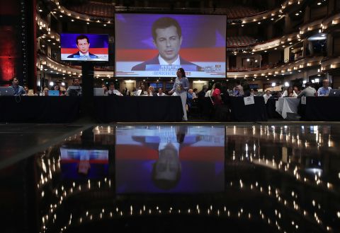 Buttigieg is seen on a monitor inside the spin room where many members of the media were set up. Buttigieg became South Bend's mayor in 2011 when he was 29 years old. From 2009 to 2017, he was an intelligence officer in the Navy Reserve, and he was deployed to the war in Afghanistan in 2014.