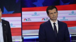 MIAMI, FLORIDA - JUNE 27: Democratic presidential candidates (L-R) former Colorado governor John Hickenlooper, former tech executive Andrew Yang and South Bend, Indiana Mayor Pete Buttigieg take part in the second night of the first Democratic presidential debate on June 27, 2019 in Miami, Florida.  A field of 20 Democratic presidential candidates was split into two groups of 10 for the first debate of the 2020 election, taking place over two nights at Knight Concert Hall of the Adrienne Arsht Center for the Performing Arts of Miami-Dade County, hosted by NBC News, MSNBC, and Telemundo. (Photo by Drew Angerer/Getty Images)