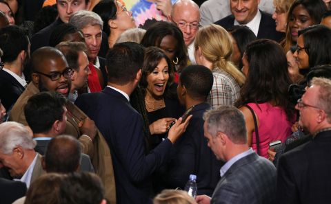 Harris speaks with guests after Thursday's debate.