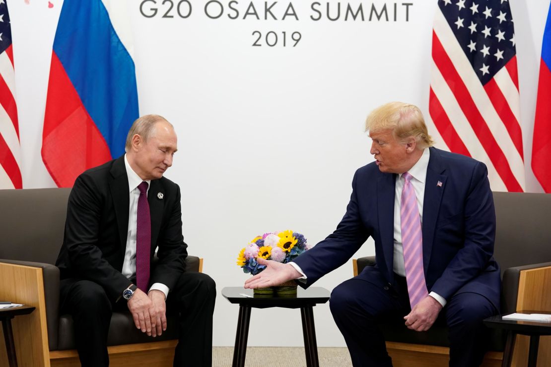 Russia's President Vladimir Putin and US President Donald Trump talk during a bilateral meeting at the G20 leaders summit in Osaka, Japan, June 28, 2019. 