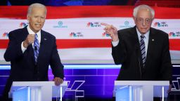 MIAMI, FLORIDA - JUNE 27: Democratic presidential candidates former Vice President Joe Biden and Sen. Bernie Sanders (I-VT) speak during the second night of the first Democratic presidential debate on June 27, 2019 in Miami, Florida.  A field of 20 Democratic presidential candidates was split into two groups of 10 for the first debate of the 2020 election, taking place over two nights at Knight Concert Hall of the Adrienne Arsht Center for the Performing Arts of Miami-Dade County, hosted by NBC News, MSNBC, and Telemundo. (Photo by Drew Angerer/Getty Images)