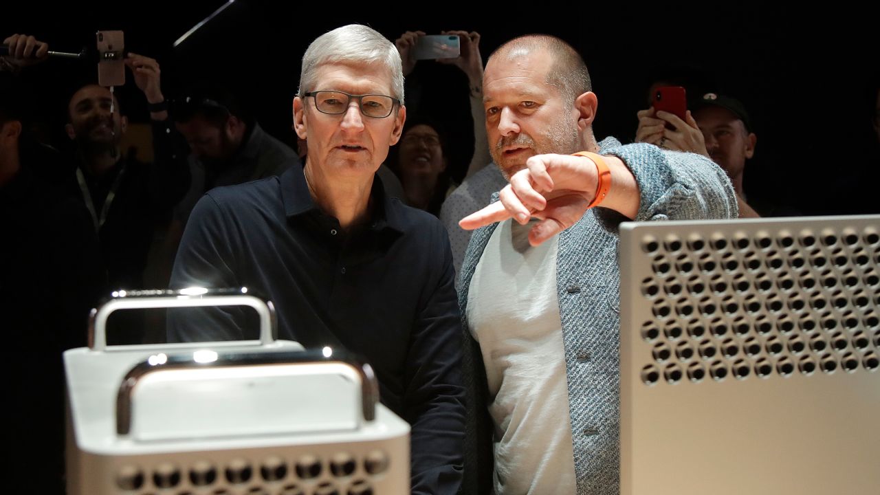 Apple CEO Tim Cook, left, and chief design officer Jonathan Ive look at the Mac Pro in the display room at the Apple Worldwide Developers Conference in San Jose, Calif. 