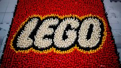 A Lego logo is pictured during the annual New York Toy Fair, at the Jacob K. Javits Convention Center on February 16, 2019 in New York City. (Photo by Johannes EISELE / AFP)