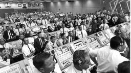 Members of the Kennedy Space Center control room team rise from their consoles to see the liftoff of the Apollo 11 mission 16 July 1969.  AFP PHOTO/NASA (Photo by NASA / NASA / AFP)        (Photo credit should read NASA/AFP/Getty Images)