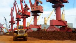 --FILE--A wheel loader piles up rare earth on a quay at the Port of Lianyungang in Lianyungang city, east China's Jiangsu province, 22 May 2016.China's rare earth industry has to produce more high-end products by further reducing the number of producers in the next five years, according to the 13th Five-Year Plan (2016-20) for the industry released by the Ministry of Industry and Information Technology on Tuesday (18 October 2016). According to the plan, rare earth with higher added value will account for 50 percent of the total output by 2020, up from 25 percent in 2015. The plan has stipulated that the total mining of rare earths in 2020 should be no more than 140,000 metric tons, compared with the 105,000 tons limit in 2016.