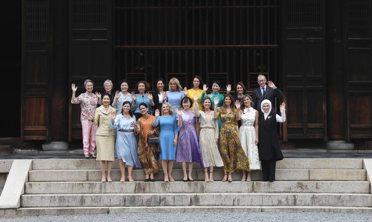 Spouses and partners of G20 leaders pose Friday for a photo at the Tofuku-ji Temple in Kyoto, Japan.