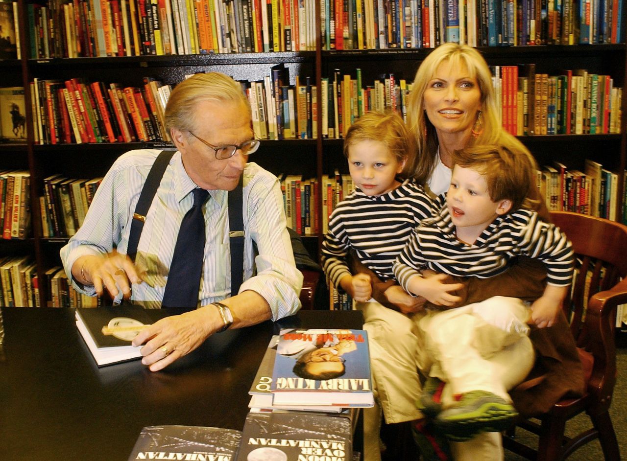King -- with his wife, Shawn, and their children Chance and Cannon -- signs copies of his mystery novel "Moon Over Manhattan" in 2003.