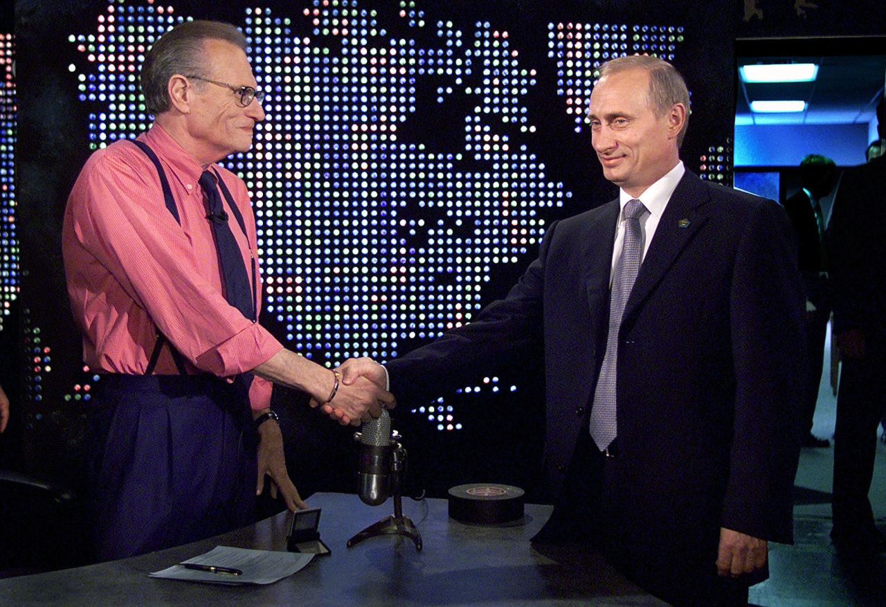 Russian President Vladimir Putin shakes hands with King before appearing on King's show in 2000.