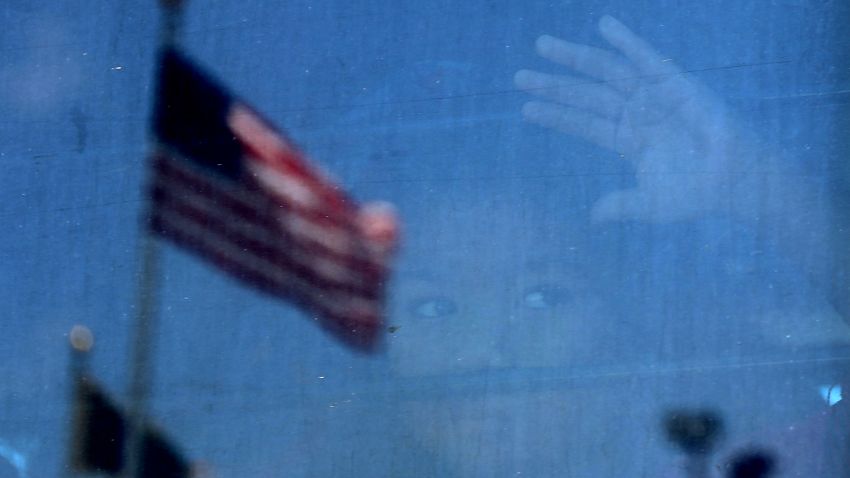MCALLEN, TX - JUNE 23: A migrant child looks out the window of a bus as protesters try to block a bus carrying migrant children out of a U.S. Customs and Border Protection Detention Center on June 23, 2018 in McAllen, Texas. Dozens of protesters blocked the bus from leaving the center resulting in scuffles with police and Border Patrol agents before the bus retreated back to the center. Before President Donald Trump signed an executive order Wednesday that halts the practice of separating families who were seeking asylum, over 2,300 immigrant children had been separated from their parents in the zero-tolerance policy for border crossers. (Photo by